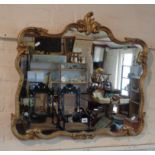 Rococo shaped wall mirror with gilt gesso frame