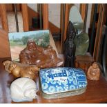 Oriental carved hardwood buddhas, African carved hardstone mother and baby sculpture, four other