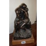 Small replica of Rodin's 'The Kiss' by Austin sculpture c. 1994 on wood plinth