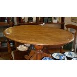 19th c. satin walnut round low table on turned centre column above tripod legs