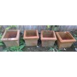 Four terracotta planters