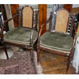 Pair of Regency grained ash elbow chairs with caned seats and backs