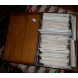 Wooden box containing vintage postcards