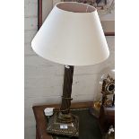 Pair of tall brass corinthian column table lamps with shades