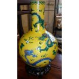 Chinese vase with dragons decoration with 6 character marks on carved hardwood stand, 33cm high