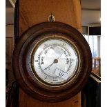 Oak framed round aneroid barometer