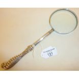 Silver plated magnifying glass with long ornate handle