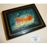 Russian lacquer box with handpainted lid, showing a winter scene, signed by artist