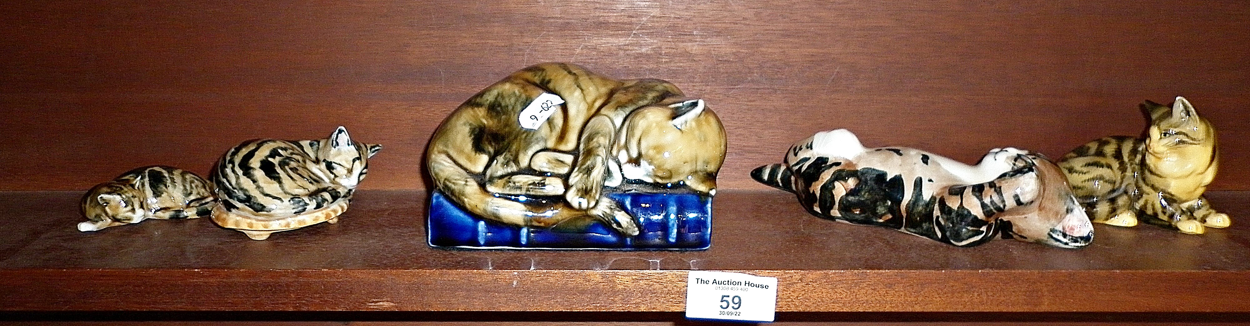 A Studio Six (Fulham) pottery cat, and four other similar cats