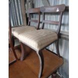 Pair of Regency sabre leg dining chairs