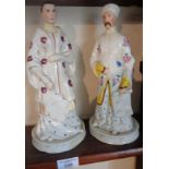 Pair of porcelain bottles in the form of Chinese figures, some restoration, 28cm high