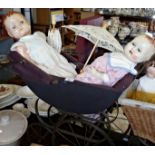 A Roddy of England composition doll (A/F) and a "Sarold" similar doll in an antique two-seater