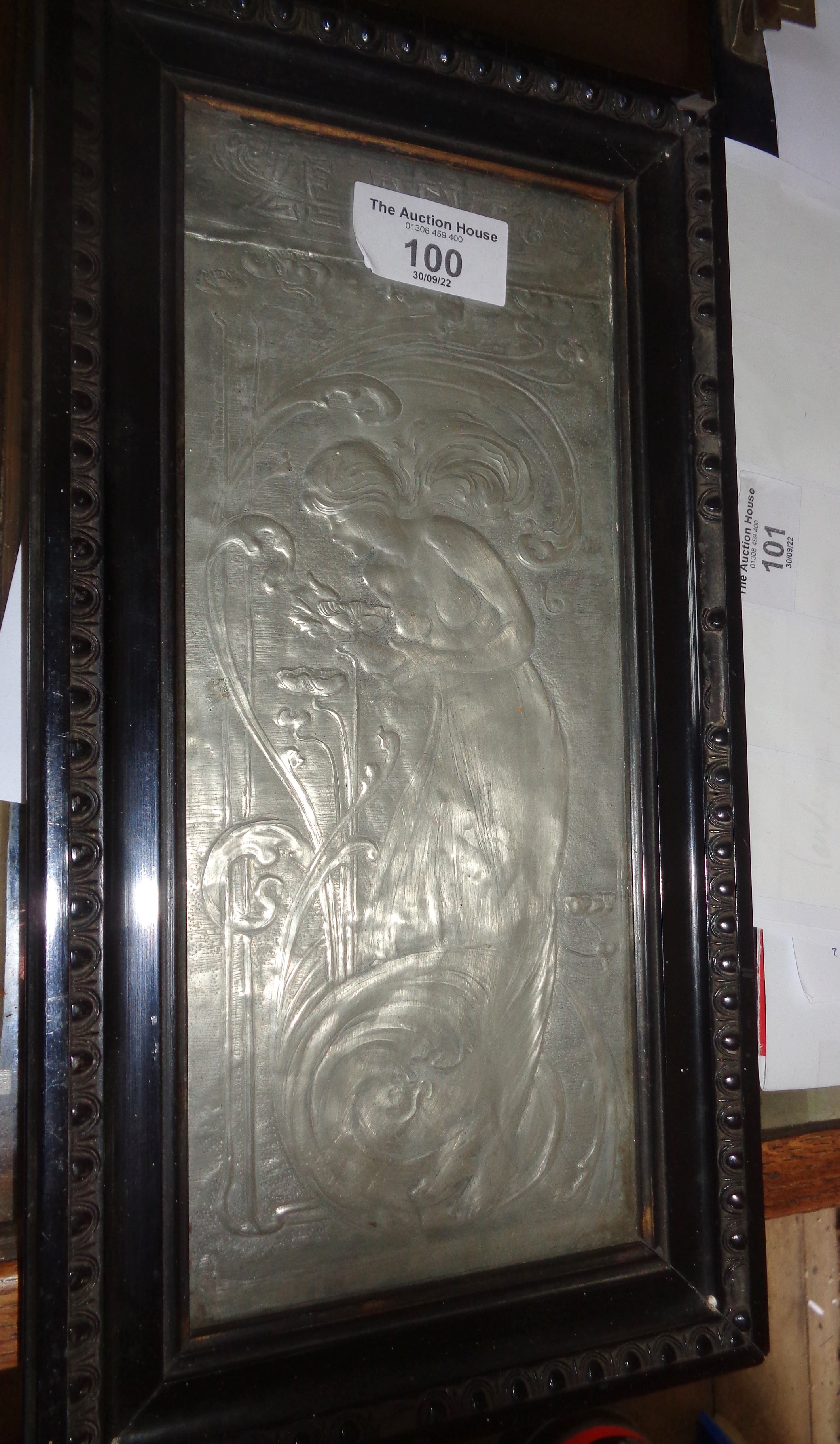 Embossed pewter Art Nouveau panel of a lady with flowers and titled "Le Reve"