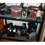 Collection of assorted vintage cameras (12 - on 2 shelves)