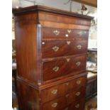 Georgian mahogany chest on chest with brushing slide and brass swan neck handles on bracket feet,