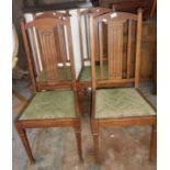 Set of four Edwardian inlaid oak dining chairs with drop-in seats