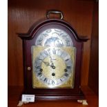 A Hermle bracket clock with brass face with silvered chapter ring and moonphase chiming on a gong