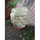 Stonework lion's head wall fountain plaque