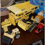 Tonka caterpillar dumper truck, a Tonka loader, bulldozer, road roller, car and cement lorry