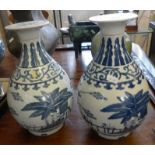 Pair of Chinese blue and white bottle vases with screw type covers, six character marks, 30cm high