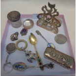 Two silver topped jars, a teething ring with jester, silver cut charm, etc.