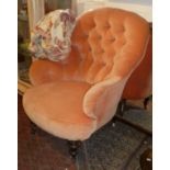 Victorian peach coloured velvet button backed armchair on turned mahogany legs