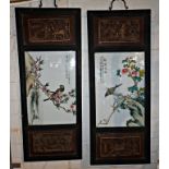 Pair of 20th c. Chinese porcelain panels in carved frames