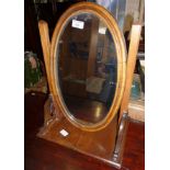 19th c. mahogany oval toilet mirror of carved supports
