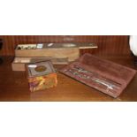 Two sets of dominoes. drawing instruments and a marbled bakelite box