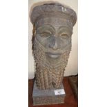 A facsimile of a Mesopotamian deity bust on plinth