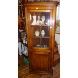 Tall two-door corner cupboard with glazed door above