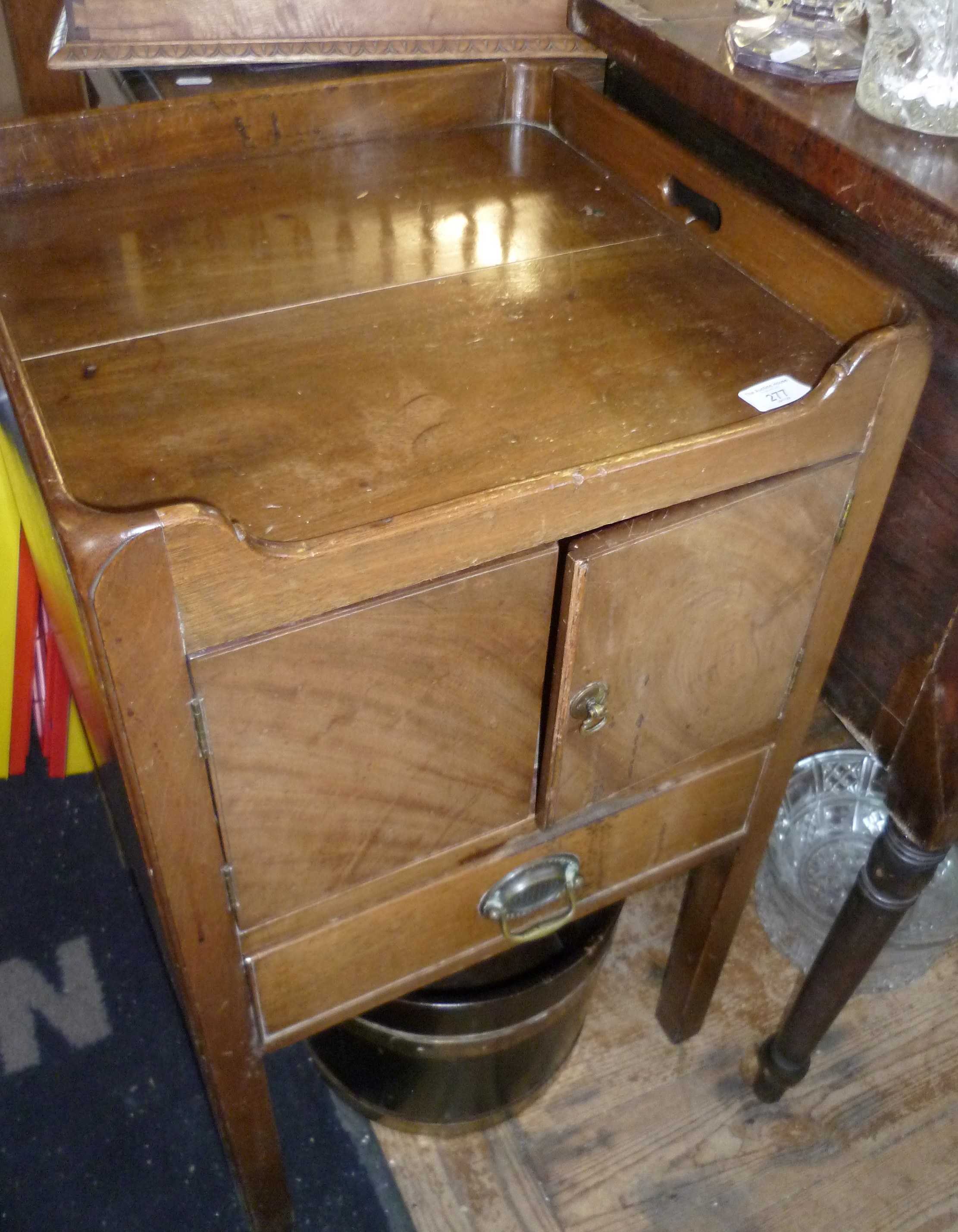 Georgian mahogany pot cupboard with two doors, drawer and having gallery to top