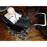 Triang coach built doll's pram with hood and cover, c. 1950's and an "OK" Kader plastic baby doll