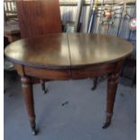19th c. mahogany extending round dining table with leaf