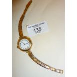 9ct gold wrist watch with filled strap