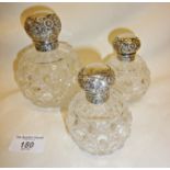 Set of three silver topped scent or vanity bottles - hobnail cut glass. Hallmarked for Chester 1897,