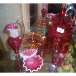 Fine etched cranberry glass decanter with handle, four cups and three other cranberry glass pieces