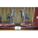 Pair of Art Deco bookends of pewter dogs on marble plinths