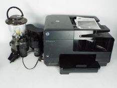 Lot to include a cased set of binoculars, a HP Officejet Pro 8615 and a lamp.