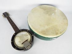 A 16" (d) bodhran drum and a vintage Marcelli mandolin banjo.