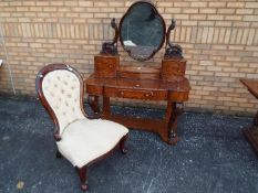 A burr wood veneered dressing table with quatrefoil swing mirror,