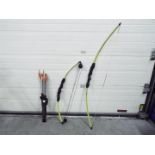 Two Barnett bows and a quiver of arrows.