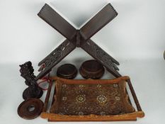 A carved folding book rest with inlaid decoration, carved tray, Oriental stands and similar.