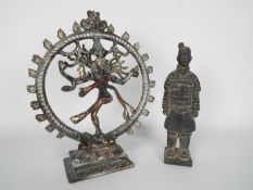 A Chinese terracotta warrior figure, approximately 21 cm (h) and a depiction of Shiva / Nataraja.