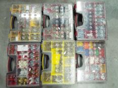 Six organiser cases containing various screws and accessories.