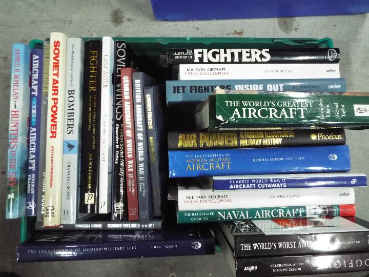 A collection of military related publications, predominantly aviation.