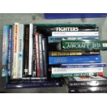 A collection of military related publications, predominantly aviation.