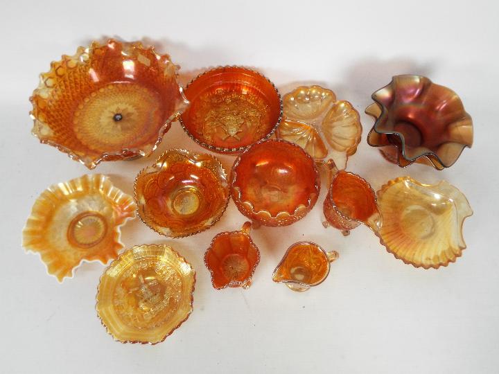 Carnival Glass - A collection of orange carnival glass to include shell dishes, jugs, flared dishes,