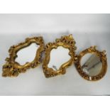 A pair of wall mirrors, approximately 48 cm x 33 cm and one other.