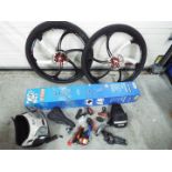 A boxed Bikemate Bike Work Stand, two Yuemei wheels with tyres and other cycling accessories.